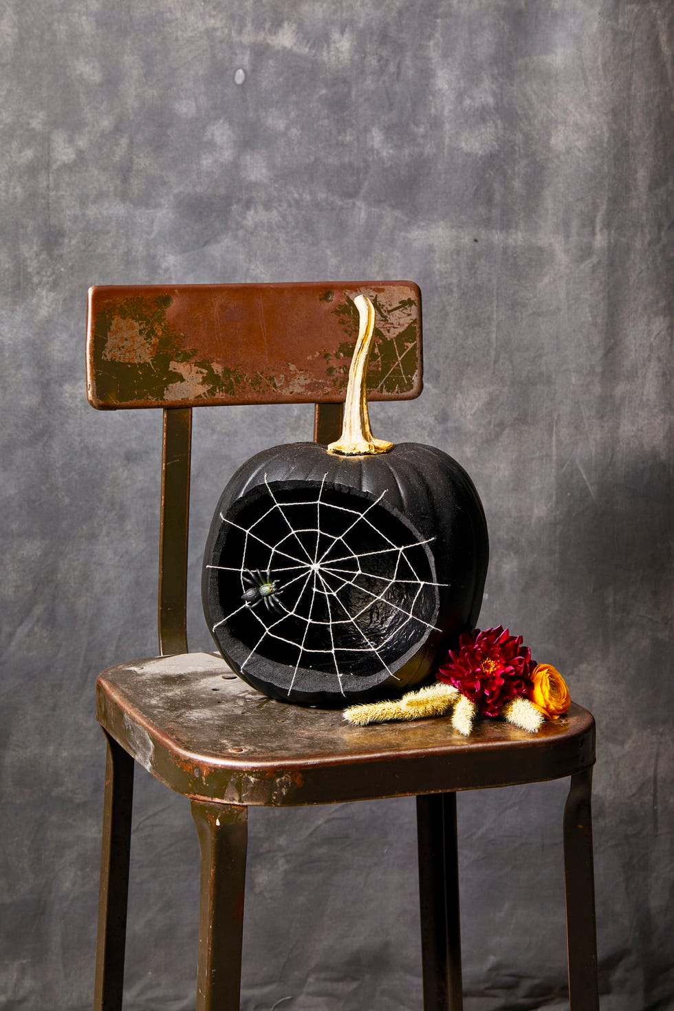 diy halloween decorations black spider web pumpkin on a chair