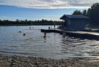 People swimming in the water Description automatically generated