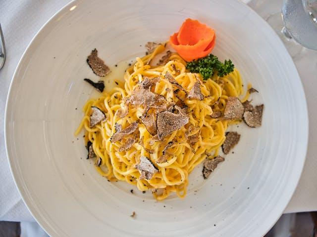 A plate of food with a piece of food on it

Description automatically generated