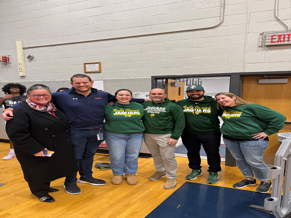 Dr. Reid with athletics staff at Falls Church High School.