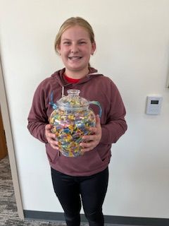 Anna holding a prize
