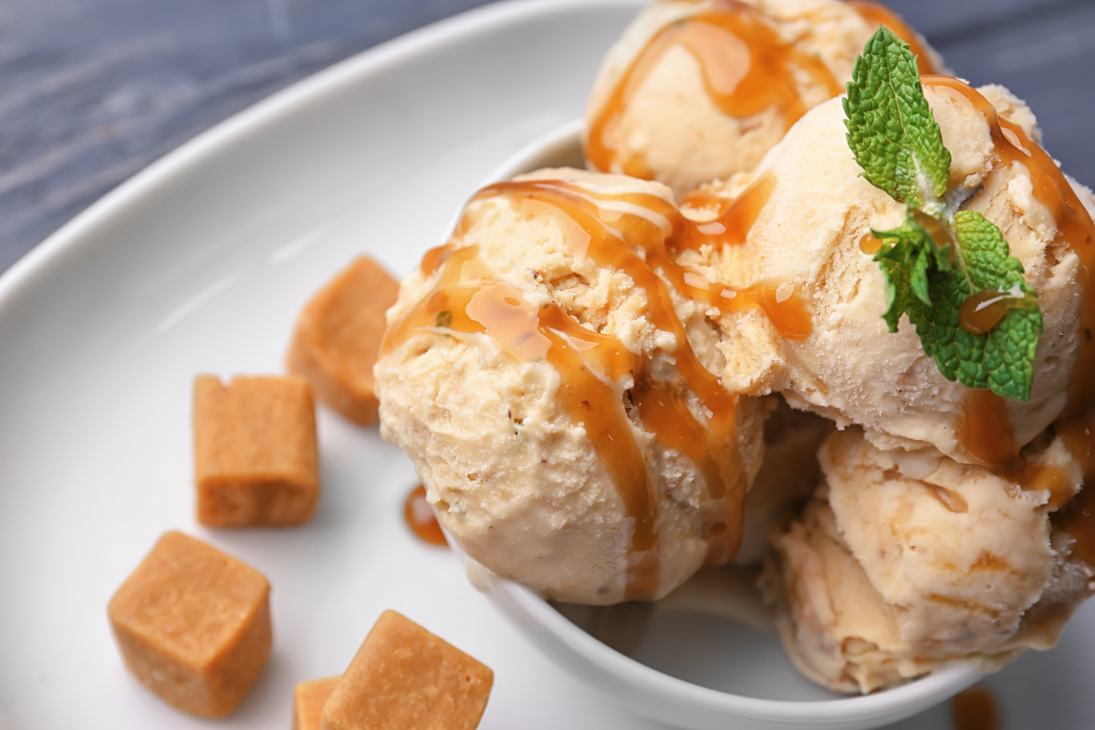 ice cream topped with caramel syrup