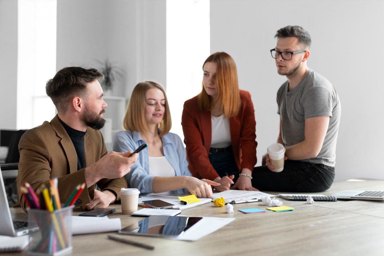 https://www.freepik.com/free-photo/young-people-having-work-meeting-office_14667515.htm#fromView=serie&page=2&position=12