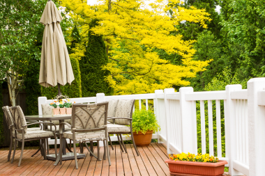 comparing michigan deck privacy solutions strategically planted trees and foliage with dining area custom built okemos