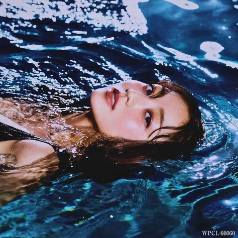 This is a picture of TWICE's Jihyo in a pool