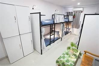 A room with bunk beds and cabinets

AI-generated content may be incorrect.