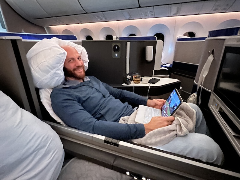 Relaxing in the comfortable seats in United Polaris Business Class. 