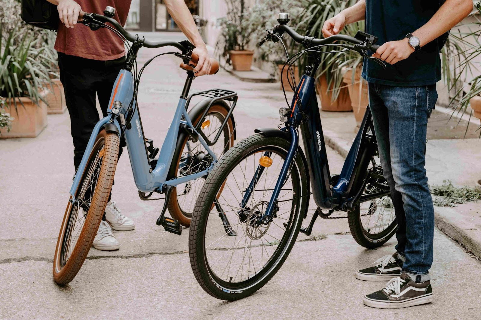 Two people who have rented an electric bike for the day in Paris.