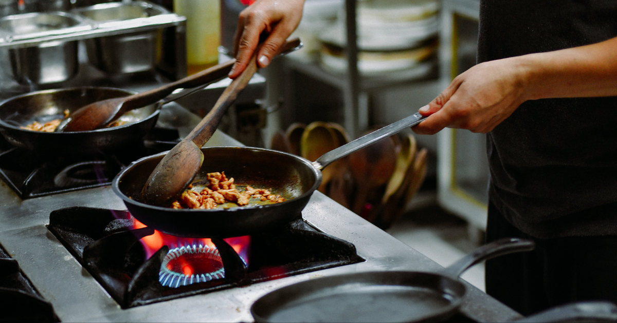 A professional cook, cooking in Demeyere fry pan