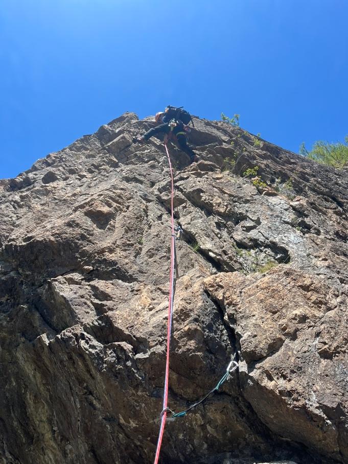 A person climbing a rockAI-generated content may be incorrect.