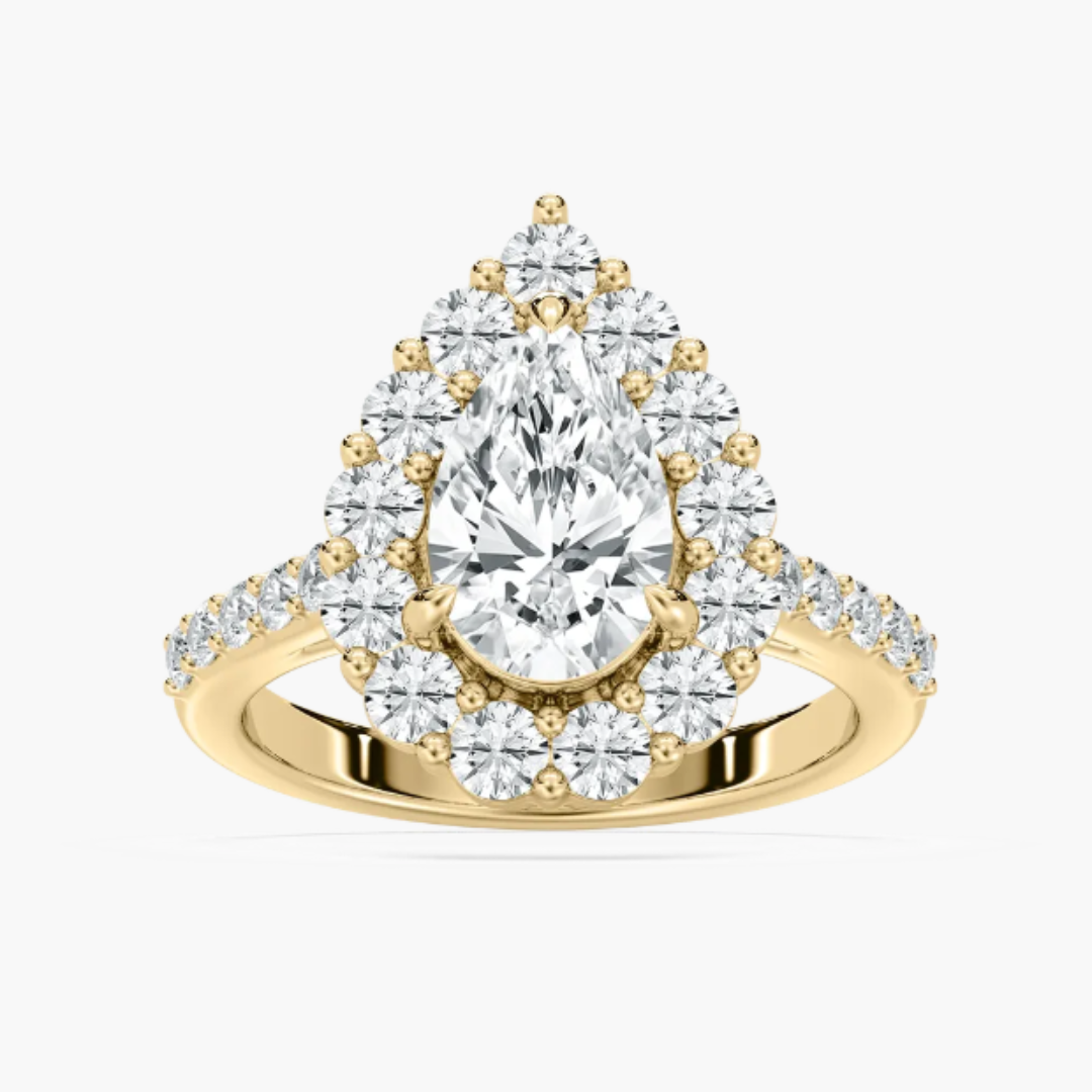 Pear lab diamond halo engagement ring in 14kt yellow gold.