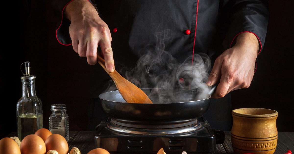 A cook is cooking in Demeyere fry pan