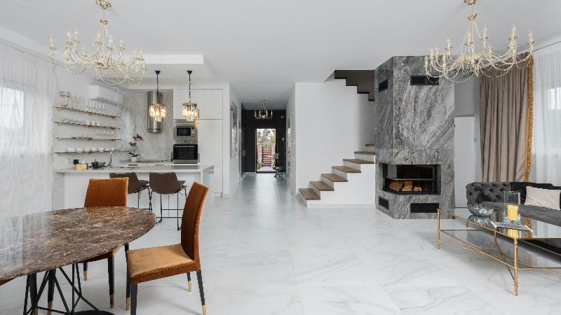 two chandeliers in a tiled kitchen