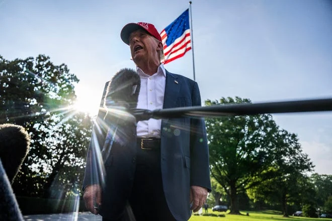 US President Donald Trump talks to members of the press as he departs from the South Lawn of the White House in Washington, DC on July 1, 2025. Trump is heading to Florida to visit "Alligator Alcatraz" immigrant detention center.