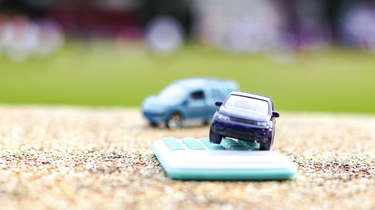 A toy cars on a calculator
AI-generated content may be incorrect.