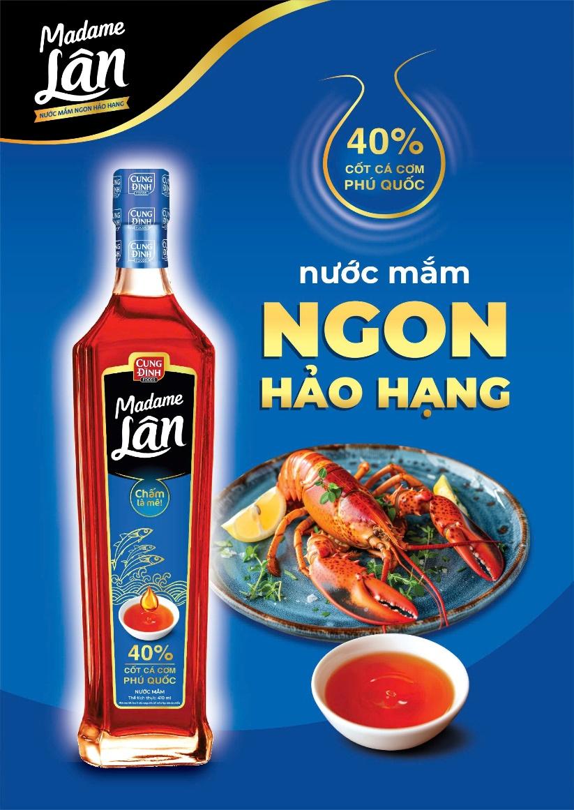 A bottle of liquid and a plate of lobster

Description automatically generated