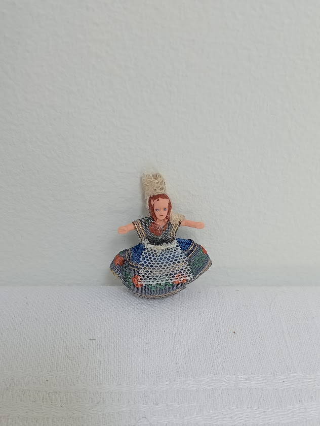 A tiny 2 inch tall doll from Brittany, France