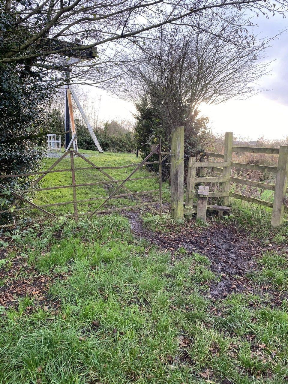 image shows a gate and style