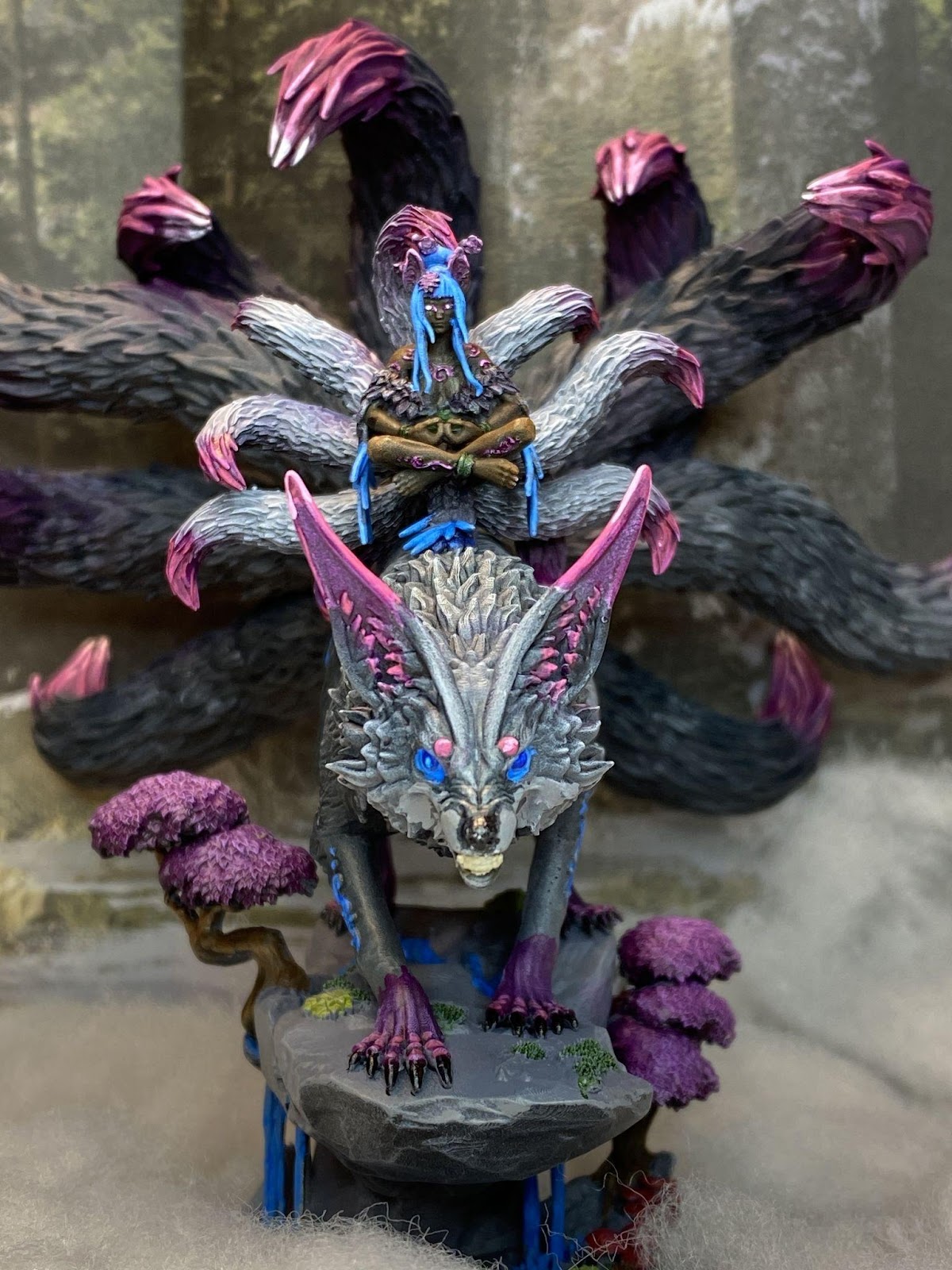 A statue of a wolf with purple and blue eyes  Description automatically generated