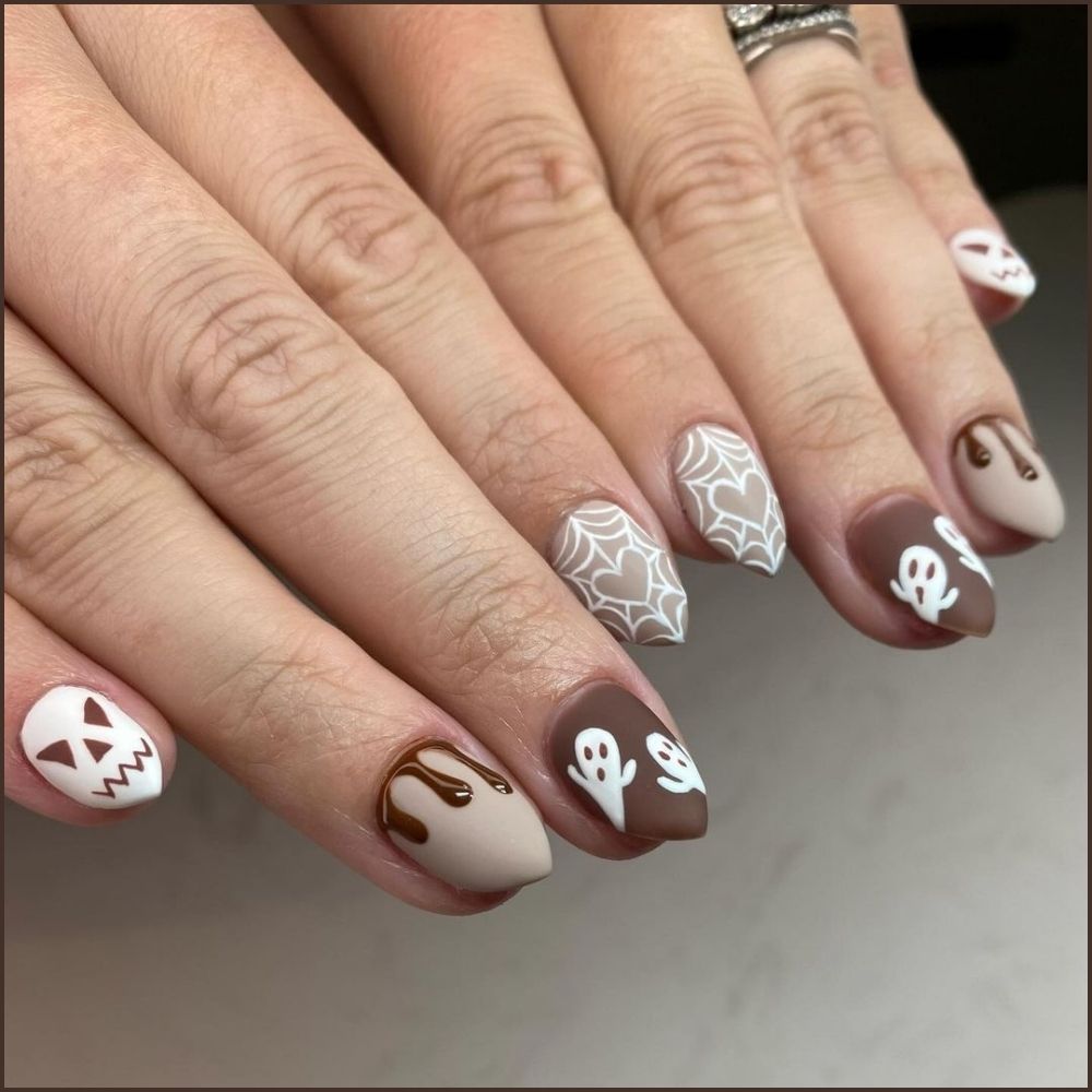 Close up of nails with spooky nails having Haunted Ghosts and Webs