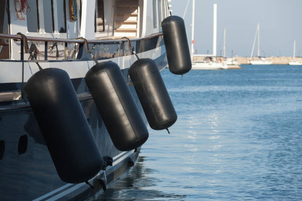 Boat with fenders correctly hung, providing protection between the hull and the dock.