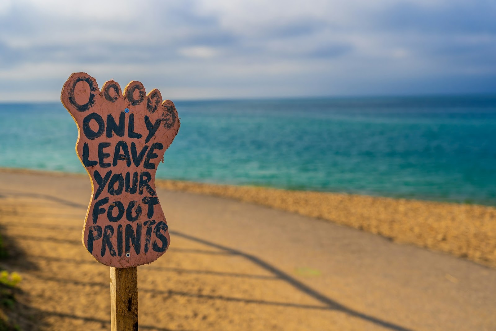 Sign supporting leaving a lower carbon footprint.