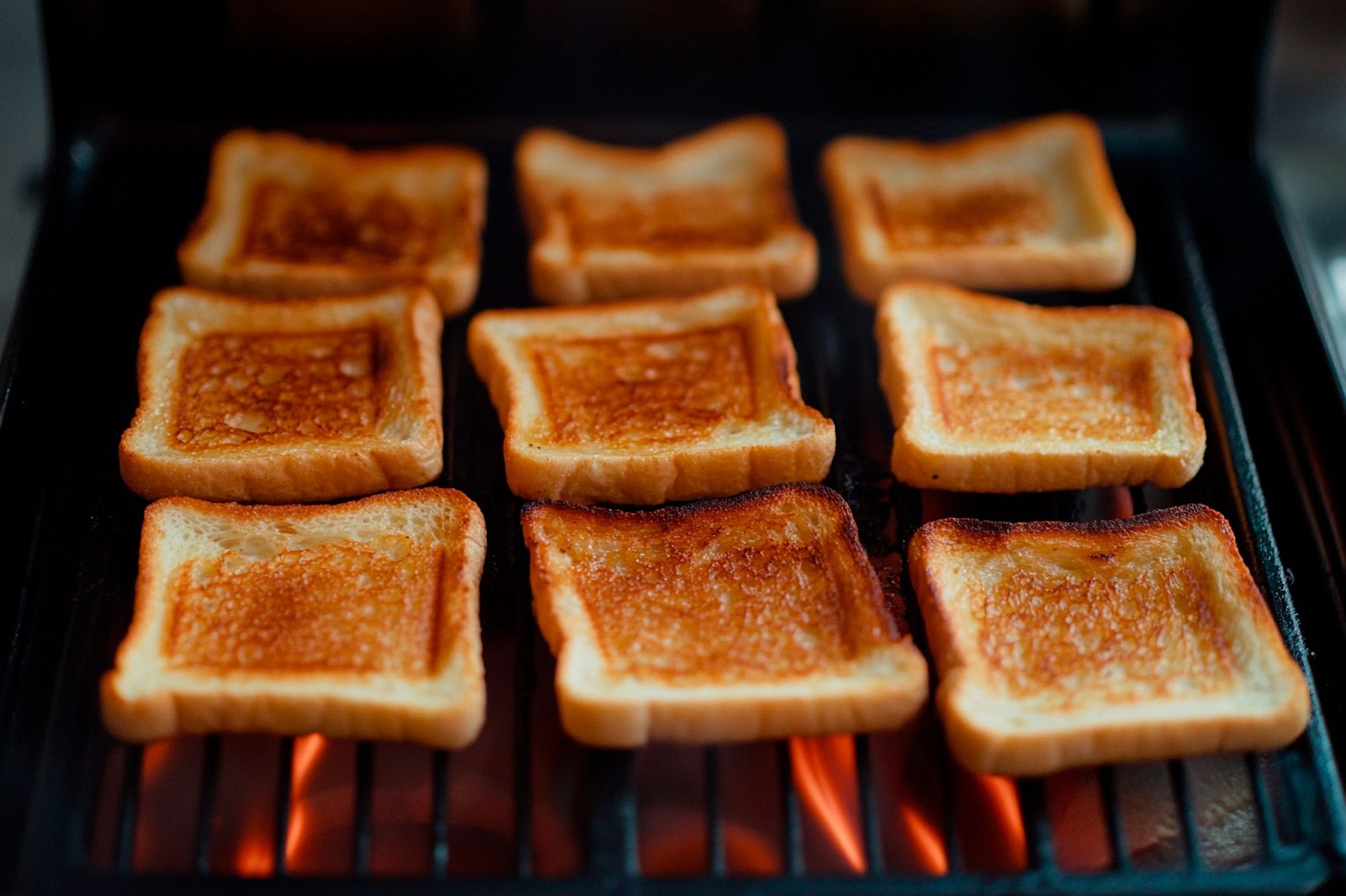 bread slices being toasted from both sides