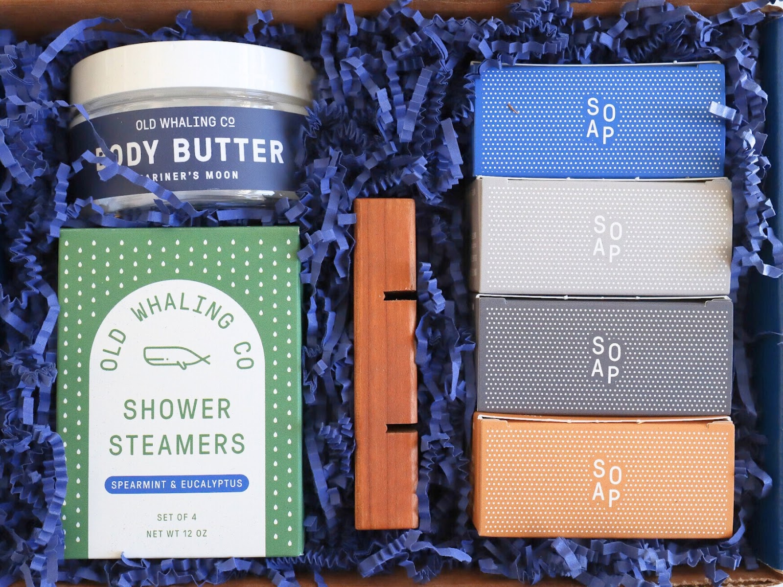 Captains Chest gift box products shown inside box with blue crinkle