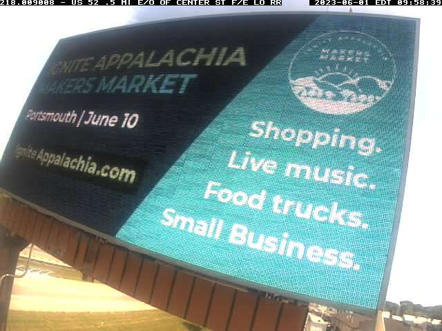 LED billboard advertising a Makers Market which reads "Shopping. Live Music. Food Trucks. Small Business.".