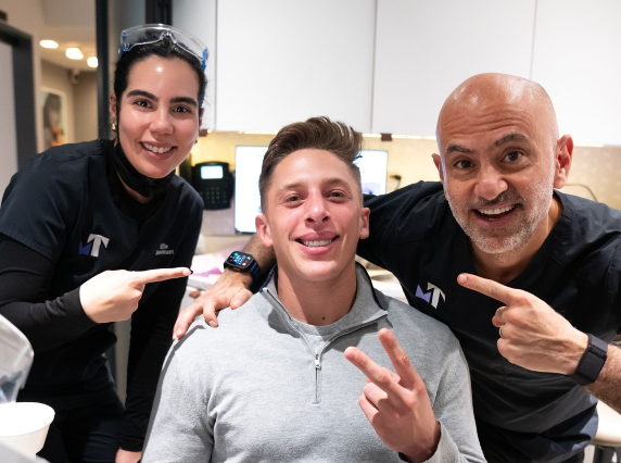 Dr. Tabib and staff with a patient