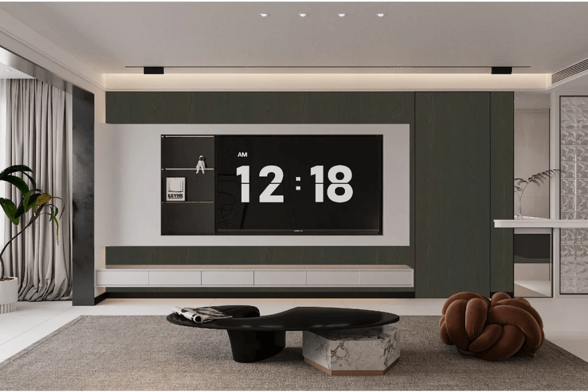 Modern living room with dark grey wood wall panel, large TV, and mounted lights creating a cozy ambiance.