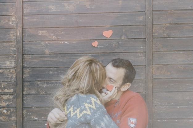 Kisses Against a Wooden Wall