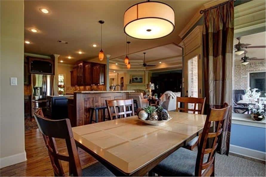 The breakfast nook offers a rectangular dining set and a round drum pendant.
