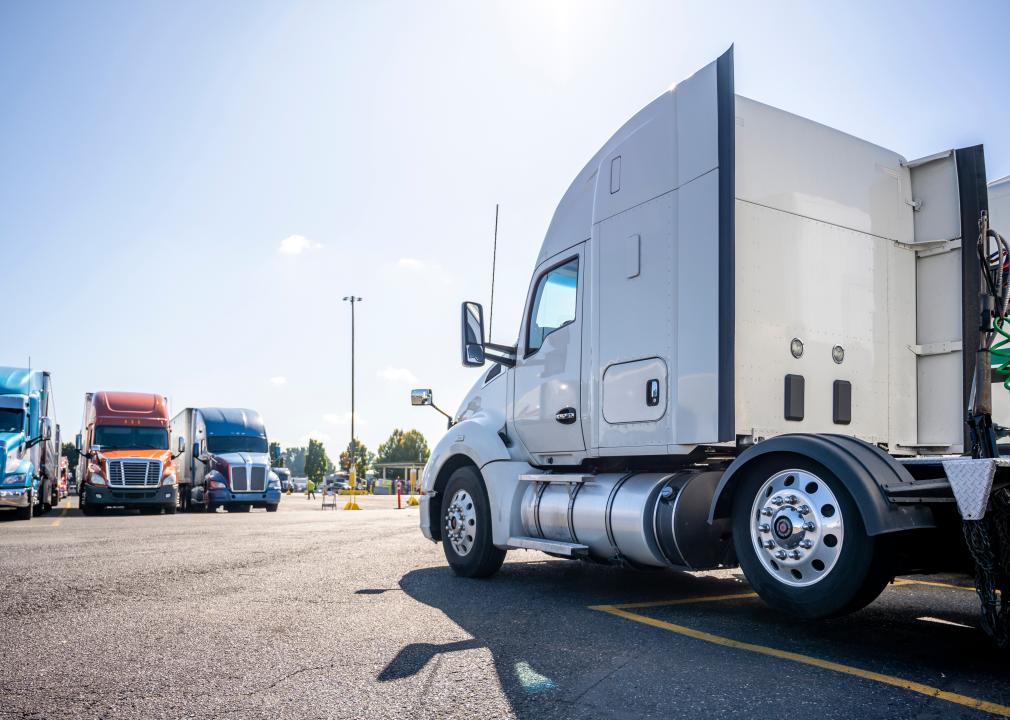 Semitrucks parked in a row.