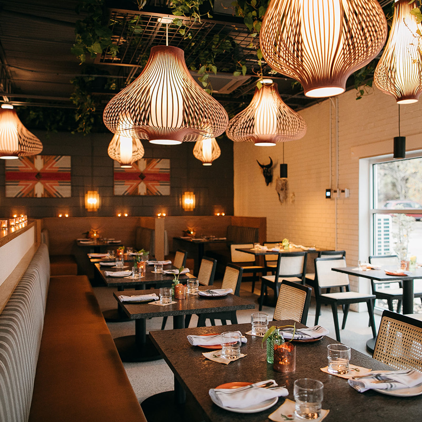 Dining room at Little Coyote in Chattanooga TN with warm lighting, modern decor, and an inviting space for guests