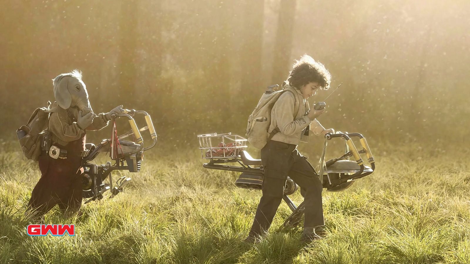 Ravi Cabot-Conyers and Kyriana Kratter with hover bikes in the grasslands.