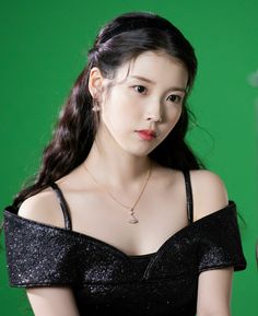 A picture of IU wearing a black gown 