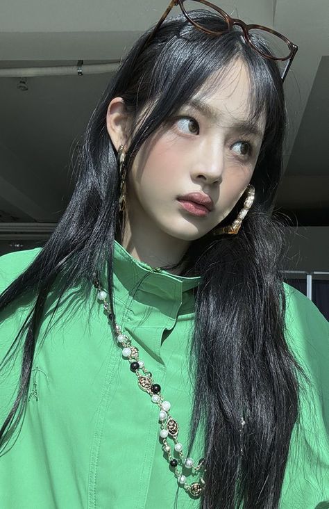 NewJeans Minji wearing a green dress 