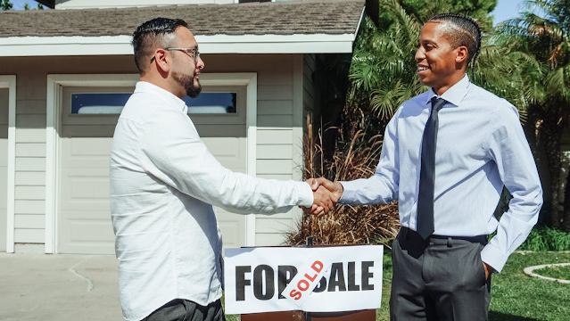 men shaking hands after house sale
