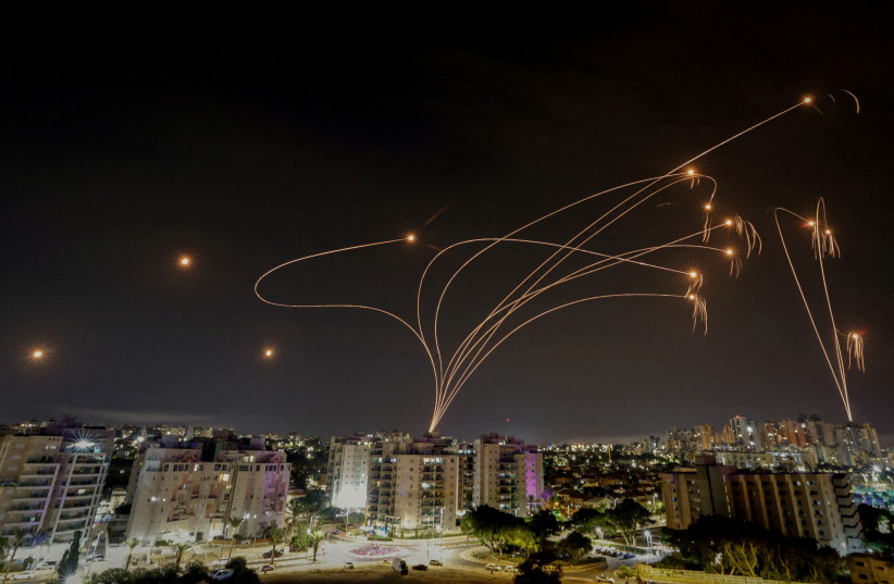  Israel's Iron Dome anti-missile system intercepts rockets launched from the Gaza Strip, as seen from the city of Ashkelon, Israel, October 9, 2023.  (credit: REUTERS/AMIR COHEN/FILE PHOTO)