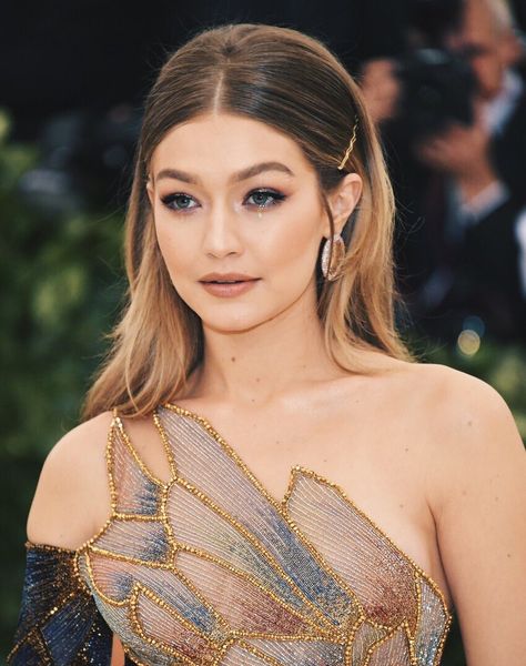 This contains an image of gigi hadid met gala