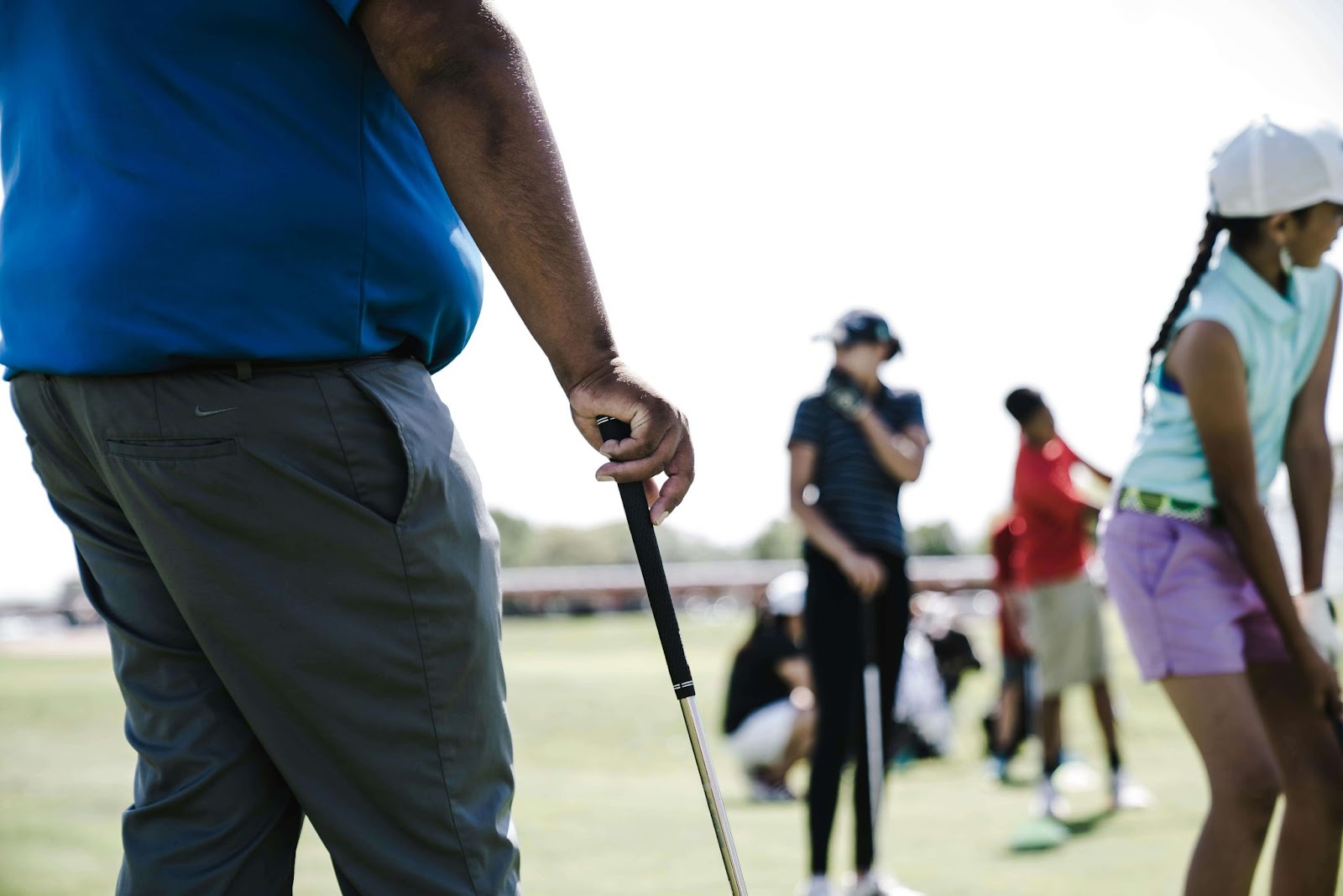 man holding putter

