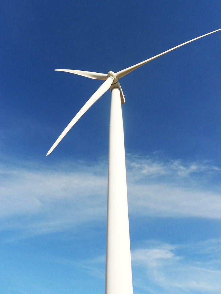 Wind turbine against a blue sky