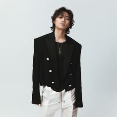 This  contain an image of  Daesung  wearing white pants and a black jacket with buttons on the lapel