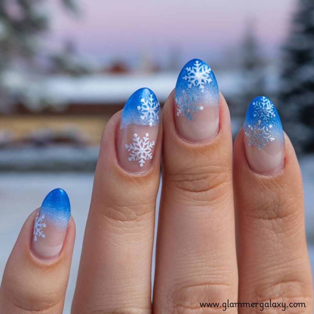 Snowflake Nails having Frosted Blue Tips with Shiny Snowflakes
