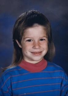 A close-up of a child smiling
Description automatically generated with medium confidence