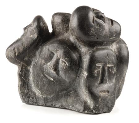 A stone sculpture of a group of people

Description automatically generated