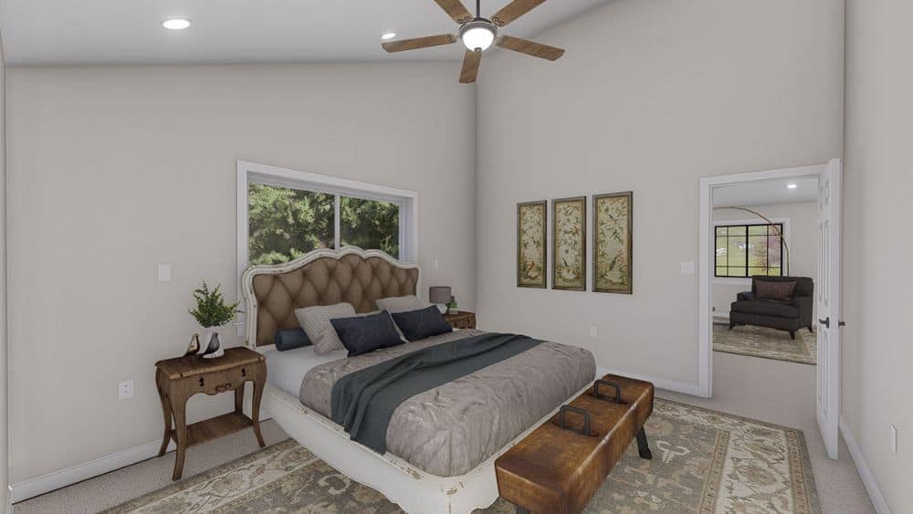 Primary bedroom with a shed ceiling, a large area rug, and a classy tufted bed complemented with wooden nightstands and an upholstered bench.