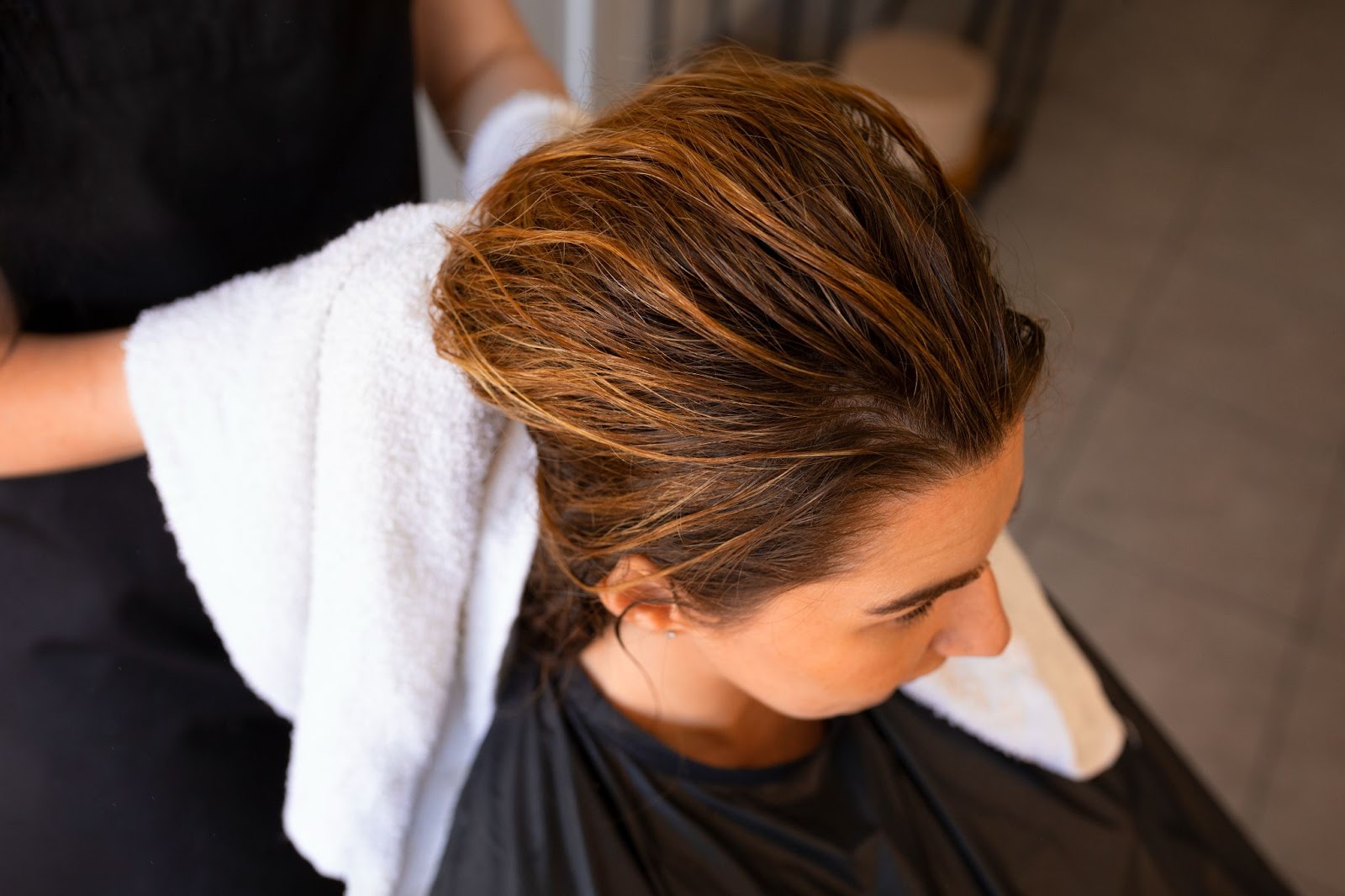 Female client getting her hair dried at the hairdresser