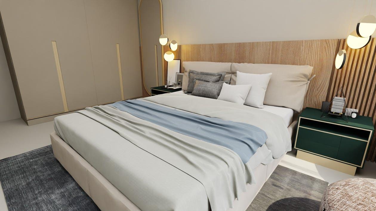 Free A modern bedroom with soft lighting, cozy blankets, and chic decor for a comfortable setting. Stock Photo